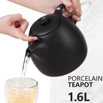 Bild in der Galerie öffnen: Porzellan Kopenhagen Teekanne mit Stövchen-Schwarz